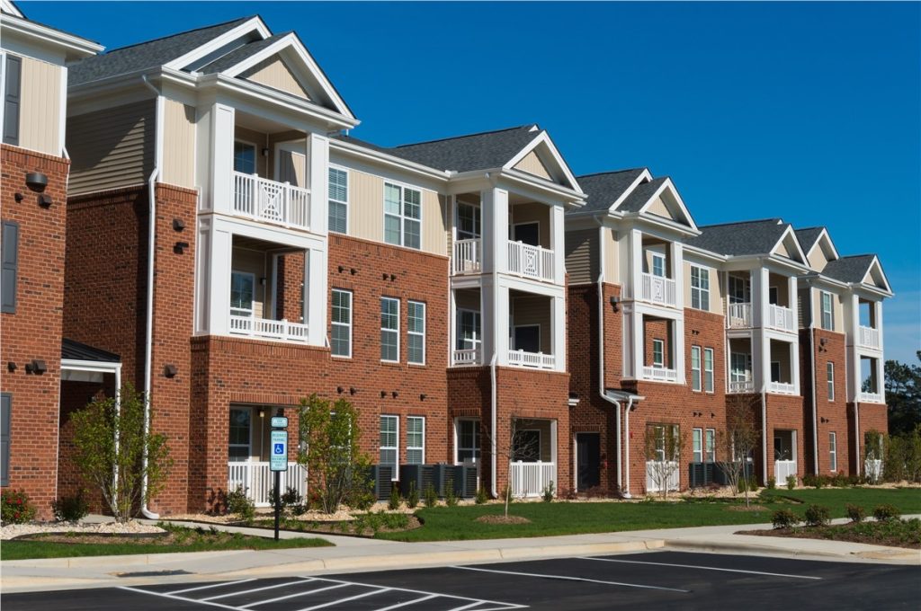 closer view of houses with residential roofs